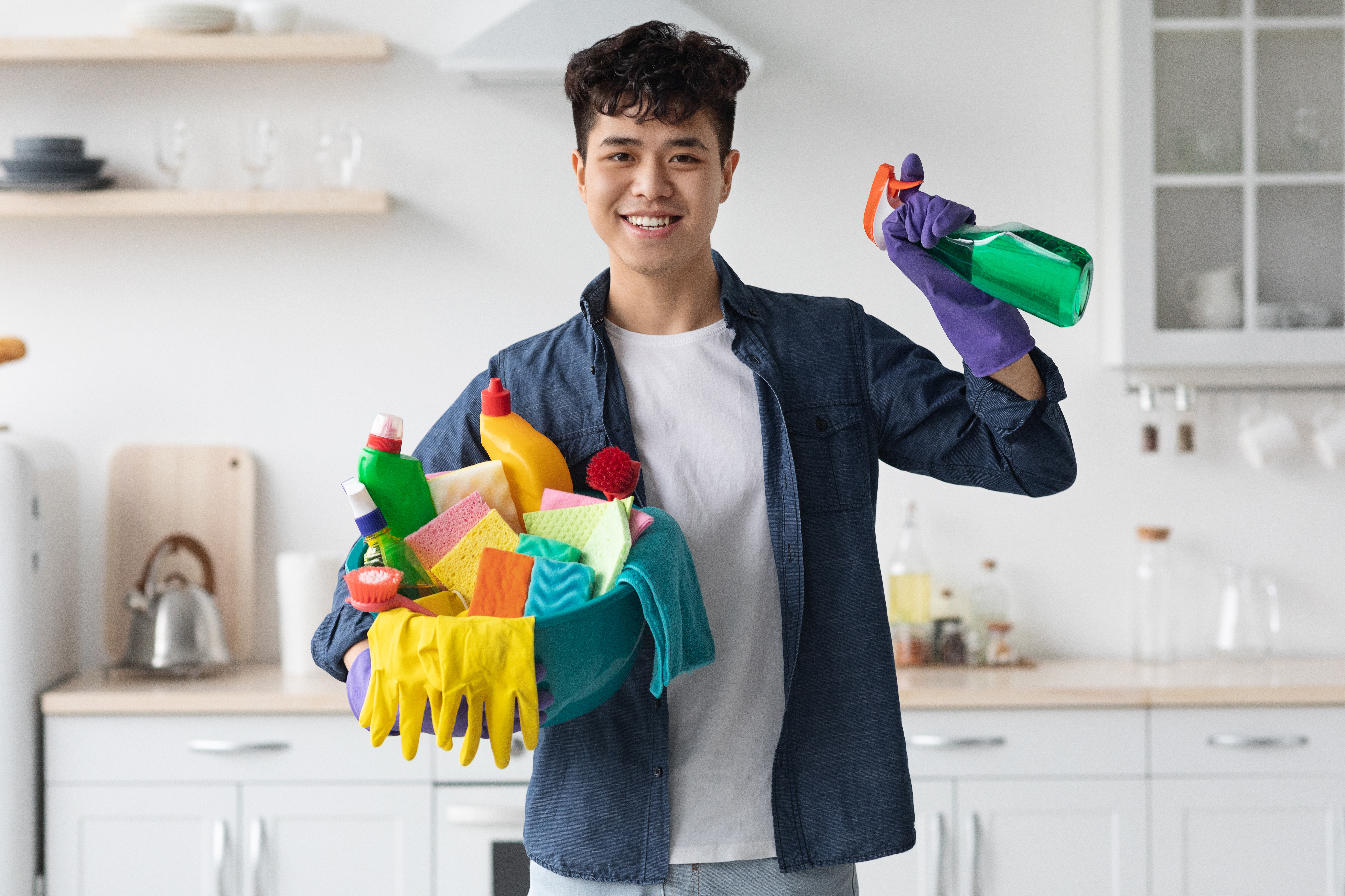 smiling-asian-man-house-keeper-cleaning-apartment-2023-11-27-05-13-08-utc